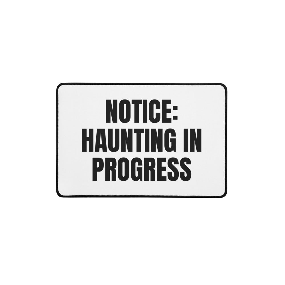 NOTICE: HAUNTING IN PROGRESS desk mat