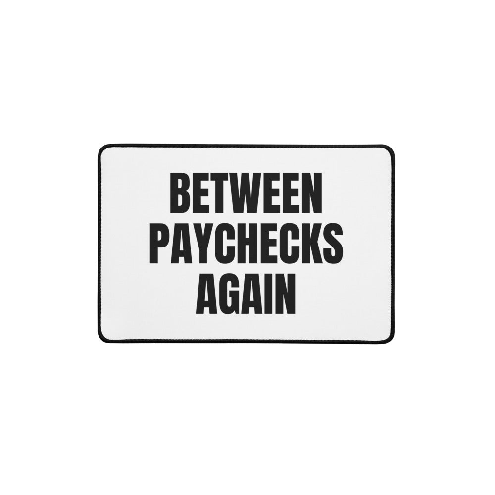 BETWEEN PAYCHECKS AGAIN desk mat