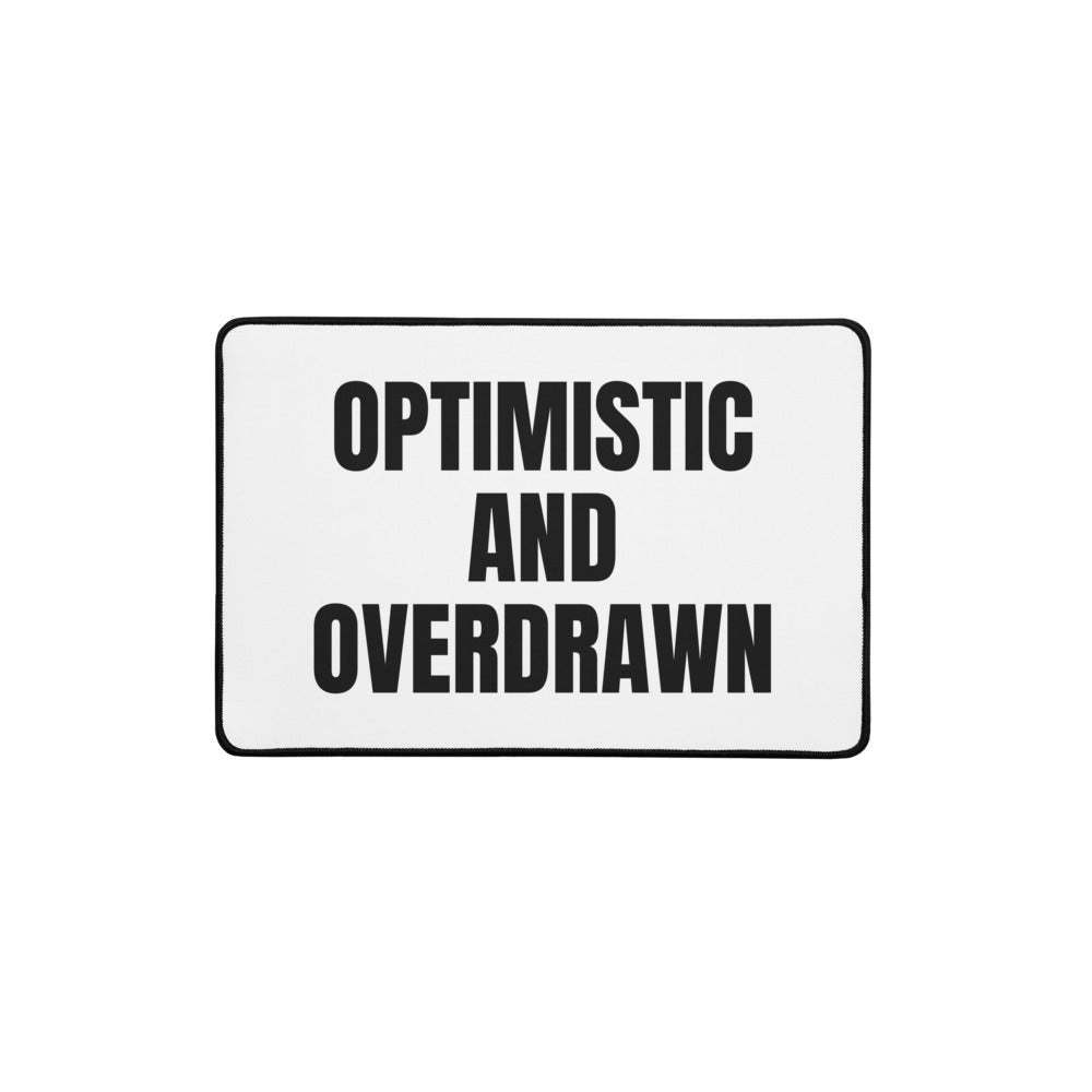 OPTIMISTIC AND OVERDRAWN desk mat