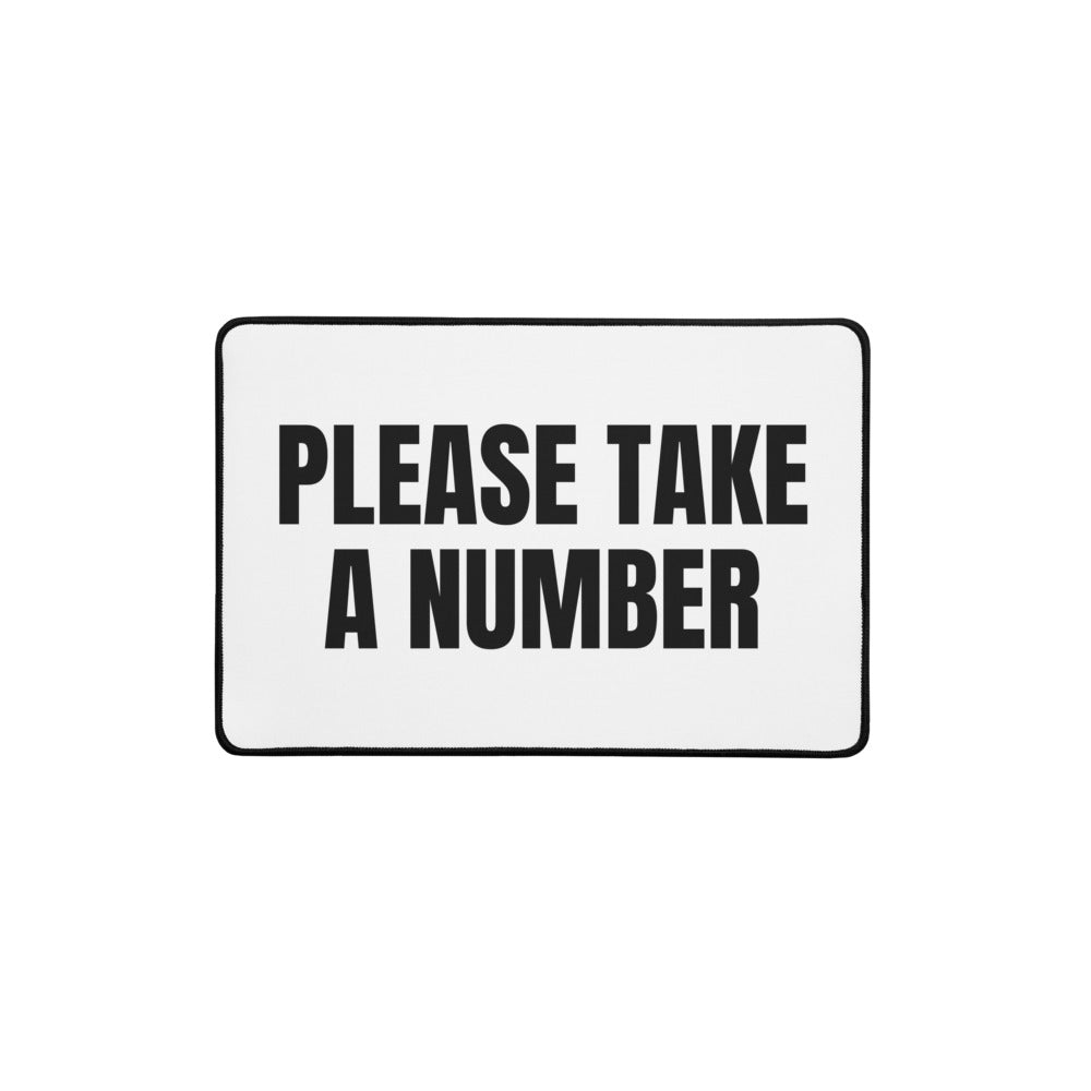 PLEASE TAKE A NUMBER desk mat