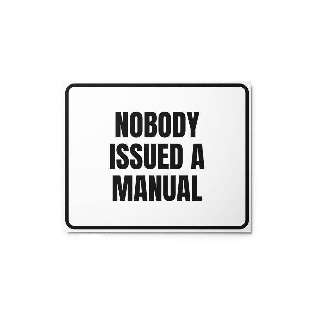 NOBODY ISSUED A MANUAL metal sign