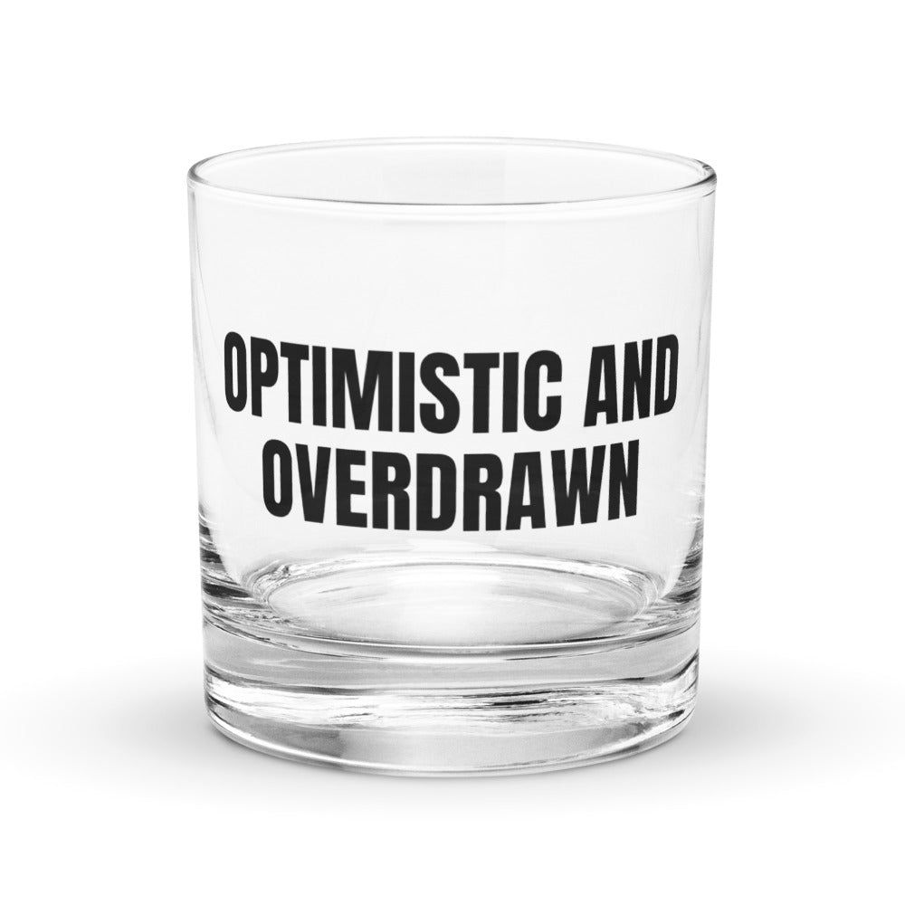 OPTIMISTIC AND OVERDRAWN rocks glass