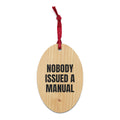 NOBODY ISSUED A MANUAL wood ornament