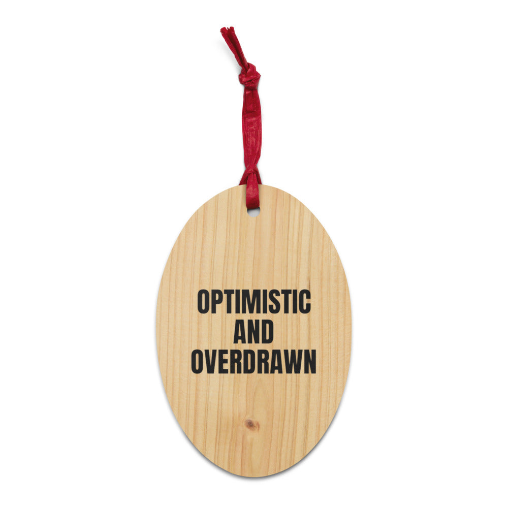 OPTIMISTIC AND OVERDRAWN wood ornament